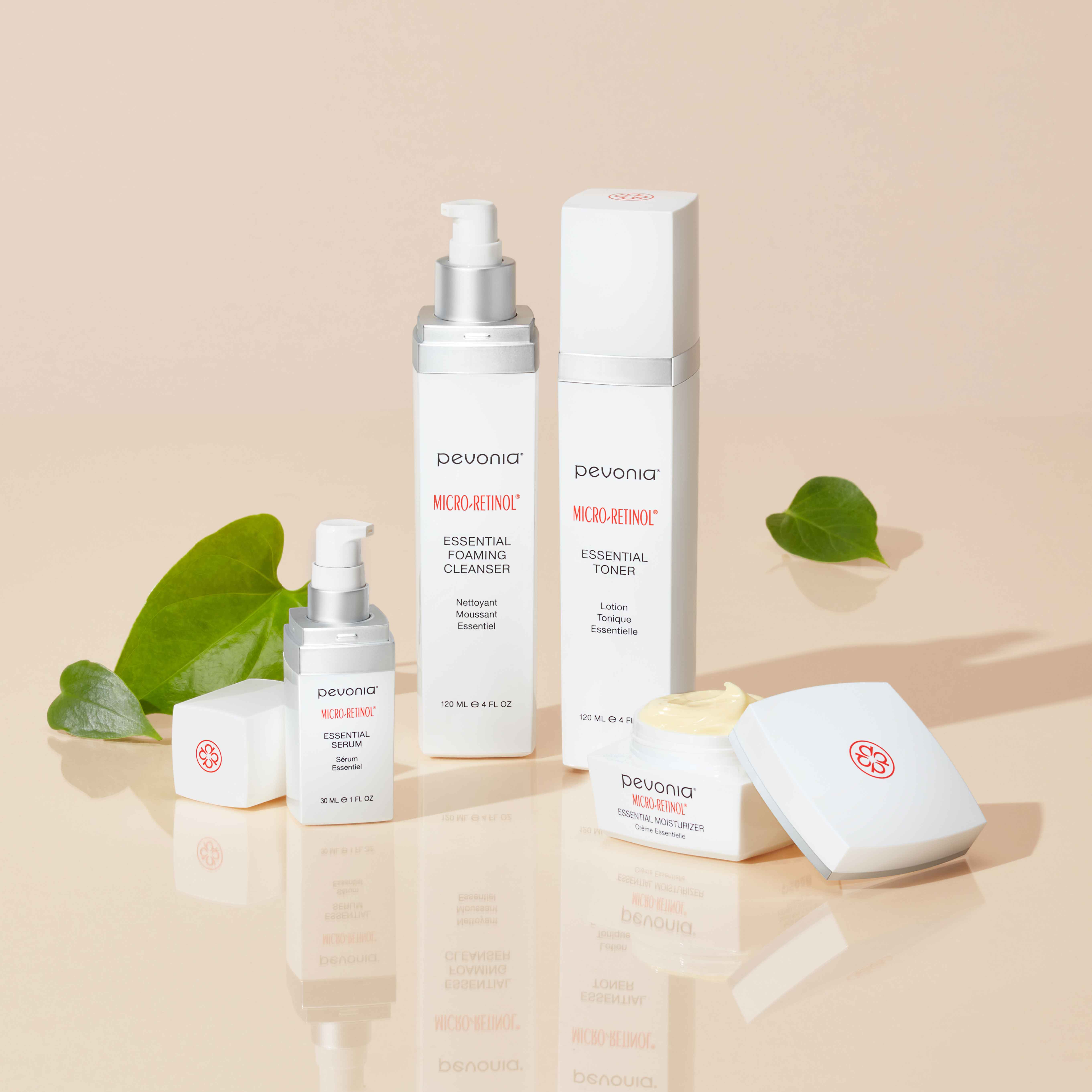 Micro-Retinol Line atop a reflective tan surface surrounded by leaves.