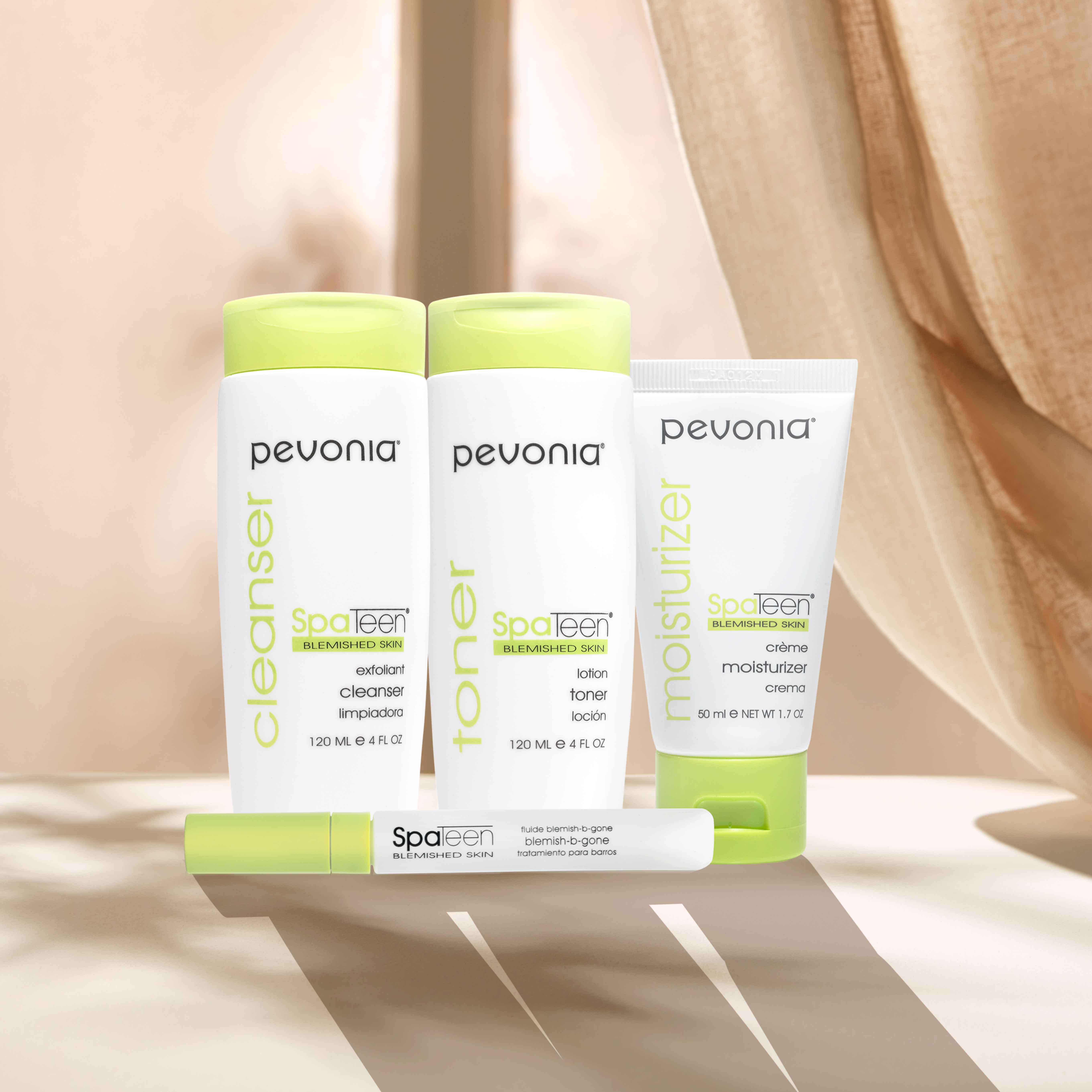 SpaTeen Line in front of beige curtains with cascading shadows.