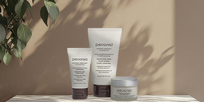 Pevonia Hyaluronic Acid Line sitting underneath plant shadows.