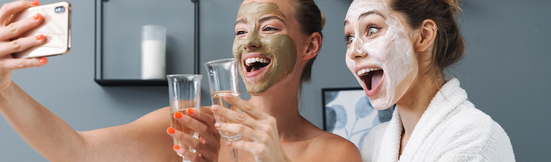 Women wearing Pevonia Radiance Line masks taking a selfie.