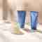 Pevonia Body Line products on a soft beige background with shadows.